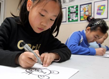 Children draw their new year's hopes in N China